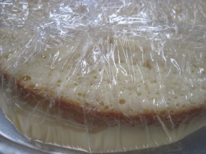 continue to add mixture until cake is saturated and then wrap plastic wrap until cake is covered well, let this sit at room temperature for about 1 hour until as much of the milk mixture as possible will be absorbed into the cake. Then refrigerate for at least 2 hours.