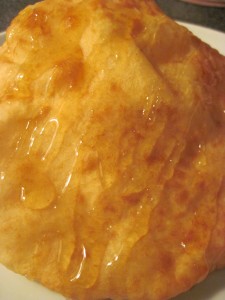 fry bread with a drizzle of honey