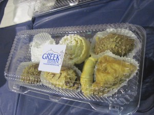 assorted Greek desserts in 'to go' containers