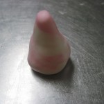 take a small piece of the remaining fondant and make a small cone, about the size of a thimble