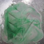 lastley use a dough scraper to remove from the counter, shape the leaf and set aside