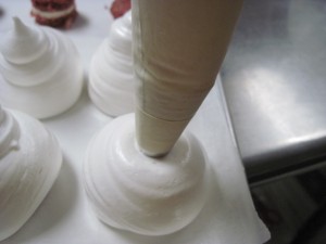once you have covered the cake, pull the bag upwards to create the body