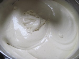 add whipped cream to cooled egg yolk mixture then fold in rum raisin paste