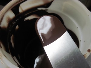 dip the back of an offset spatula into melted non tempering chocolate
