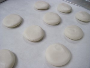 roll and then flatten each ball into a pattie