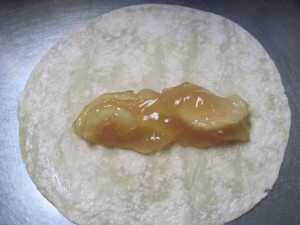 tortilla with apple filling and glue around the border