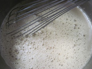 add the other half of mil mixture to the bubbling sugar and mix until it comes together with a whisk