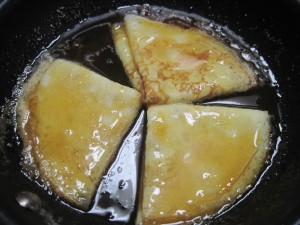 add crepes to warm syrup