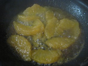 toss oranges into caramel sugar to warm through also