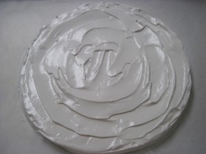 pour the meringue out onto the parchment sheet with the outline of your chosen size and use an offset spatula to spread out