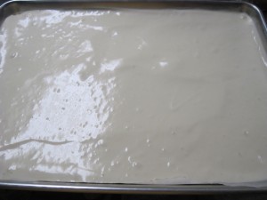 add batter to a paper lined sheet pan