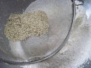 last grind of almonds, if all pieces are small just add to the rest of the flour