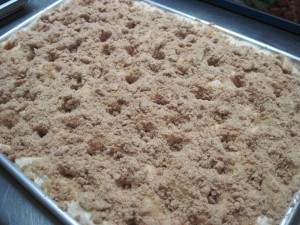 add all of streusel and gently create crevices in the dough before baking