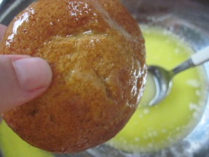 Roll the filled cake quickly in the melted butter