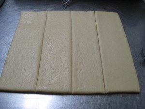 cut the donut dough into 4 pieces