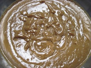 perfect butterscotch pudding ready to pour over the baked chocolate pumpkin pie filling