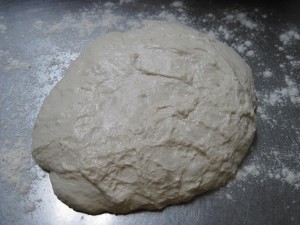 After proofing ciabatta dough for 3 hours, pour out onto a floured surface