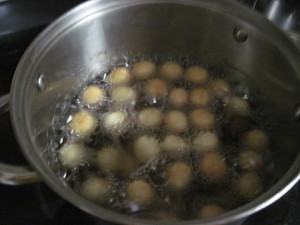 fry the pignolata balls until golden brown
