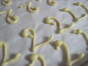 bake eclair swan necks until they are set to the touch