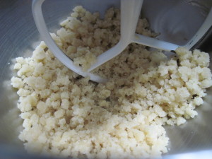 Beat almond paste and sugar to a coarse meal