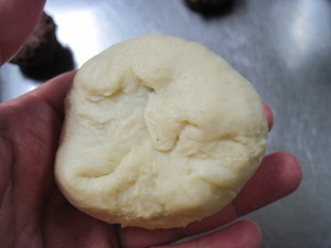 Close the bottom of the dough over the filling