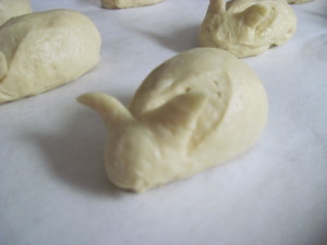 Using a pair of scissors, cut the ears out of the dough