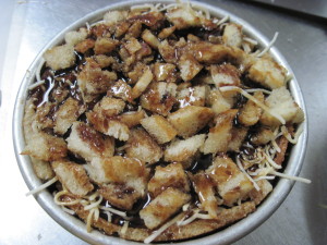 Finish layering the rest of the capirotada and add the other half of the syrup