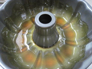 Add the caramel to the bundt pan first, and then use pan spray