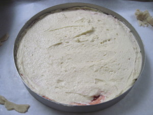 Add additional almond batter on top of strawberry drizzle