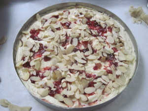 Top with sliced almonds and bake